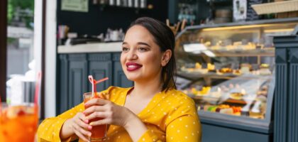 Woman enjoying cafe visit with food allergy protection